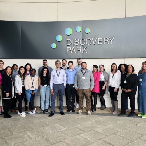 Discovery Spark cohort group photo in front of Discovery Park sign